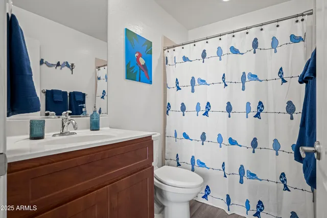 a bedroom with a bed and a dresser