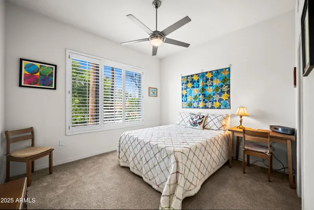 a bedroom with furniture and a window