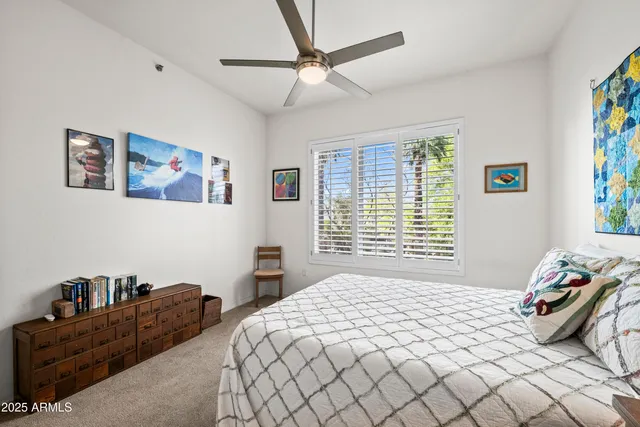 a view of a hallway with wooden floor and furniture