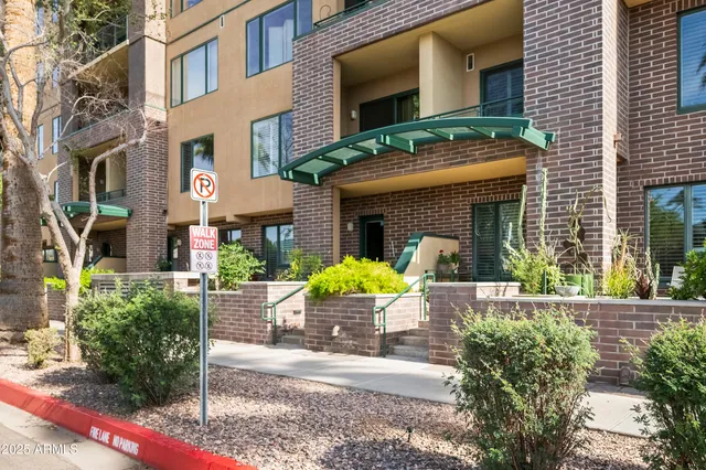 a front view of a building with swimming pool