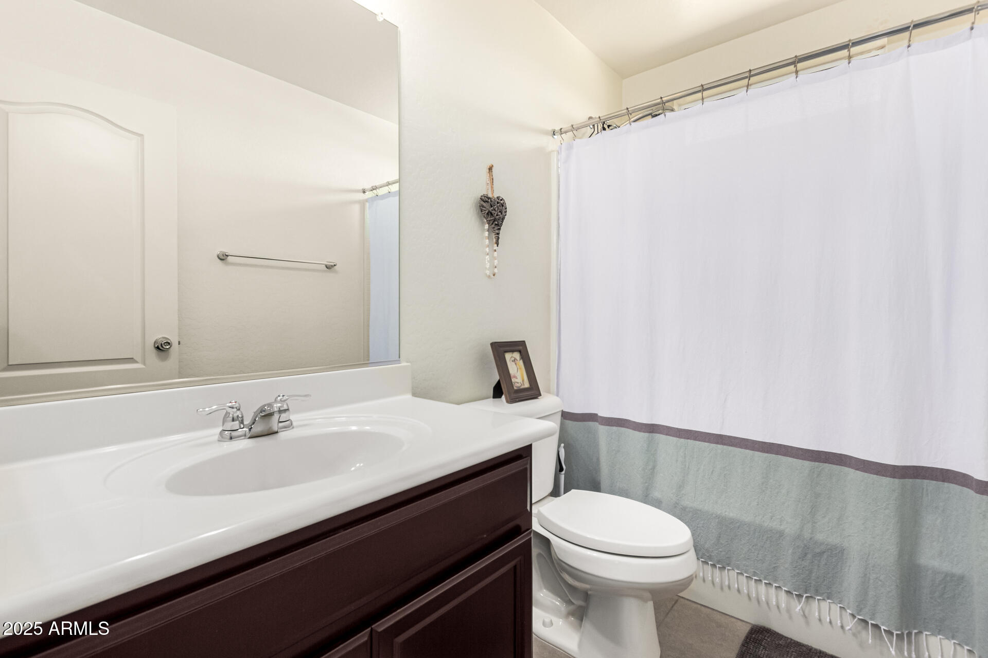 820 Constance Way Phoenix, AZ 85042 - Photo 17 of 29 a bathroom with a sink a toilet and shower