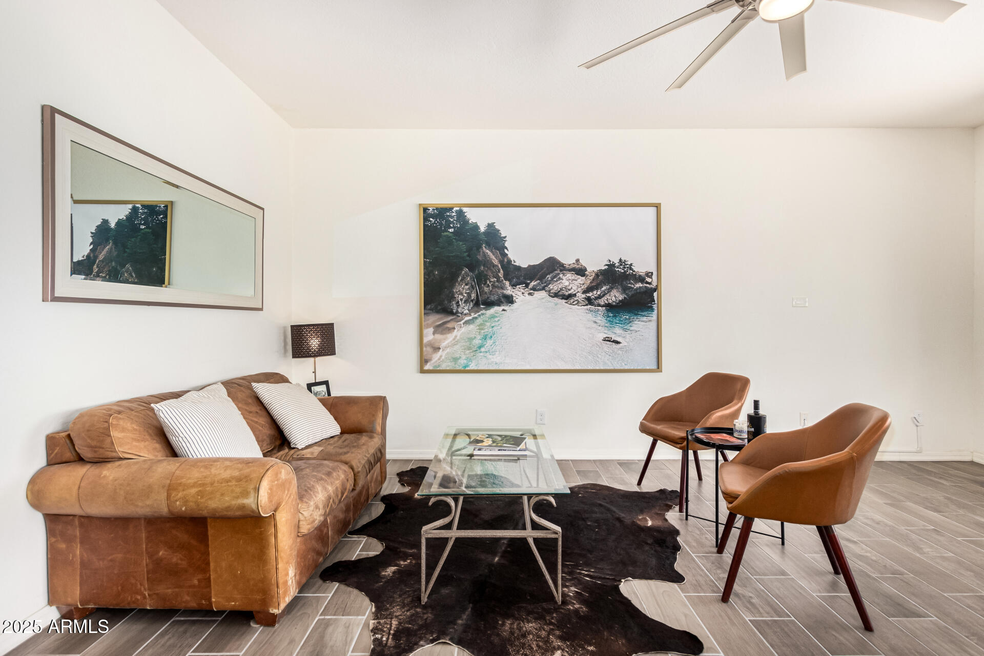 820 Constance Way Phoenix, AZ 85042 - Photo 2 of 29 a living room with furniture and a painting on the wall