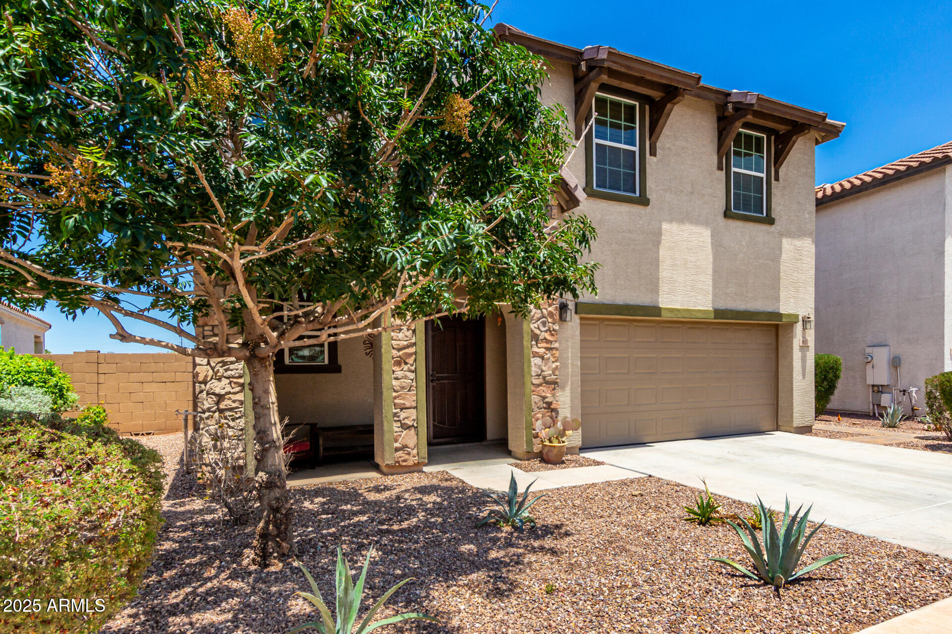 820 Constance Way Phoenix, AZ 85042 - Photo 22 of 29 a front view of a house with a yard