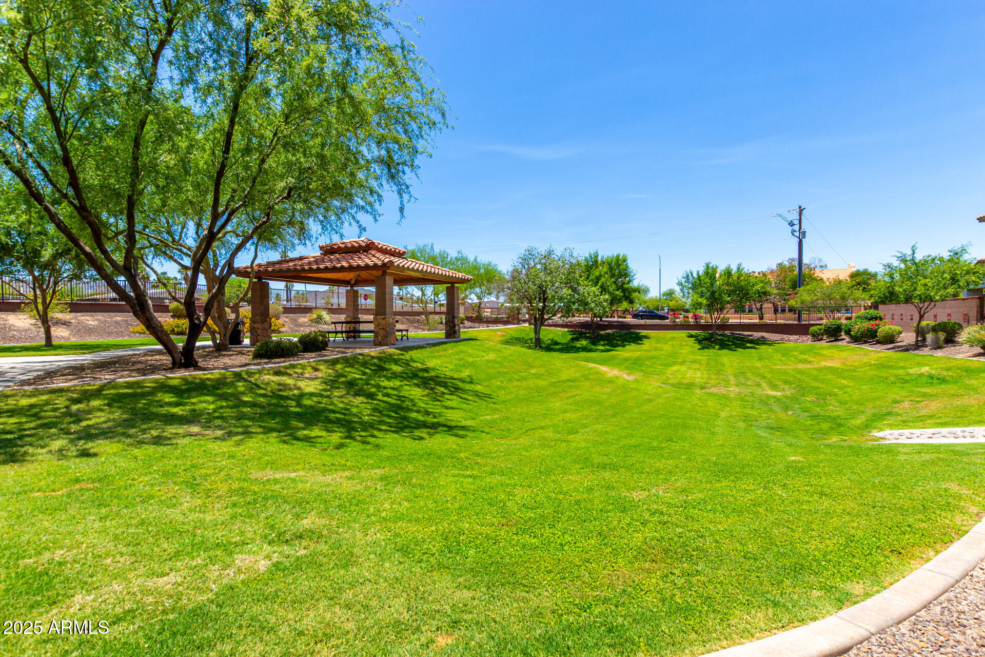 820 Constance Way Phoenix, AZ 85042 - Photo 26 of 29 a front view of a house with garden