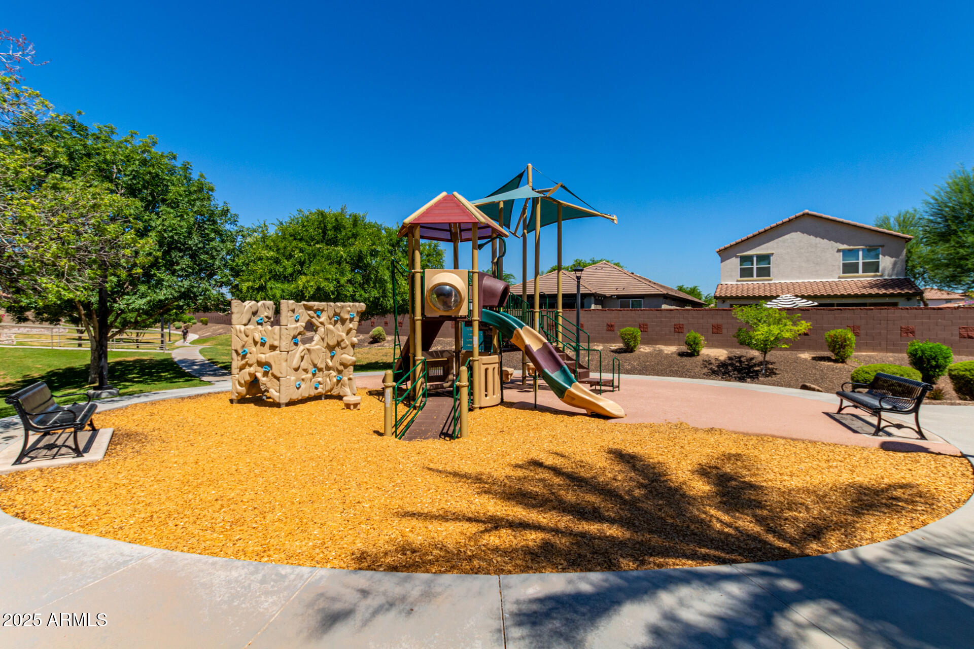 820 Constance Way Phoenix, AZ 85042 - Photo 27 of 29 a view of pool with lawn chairs under an umbrella