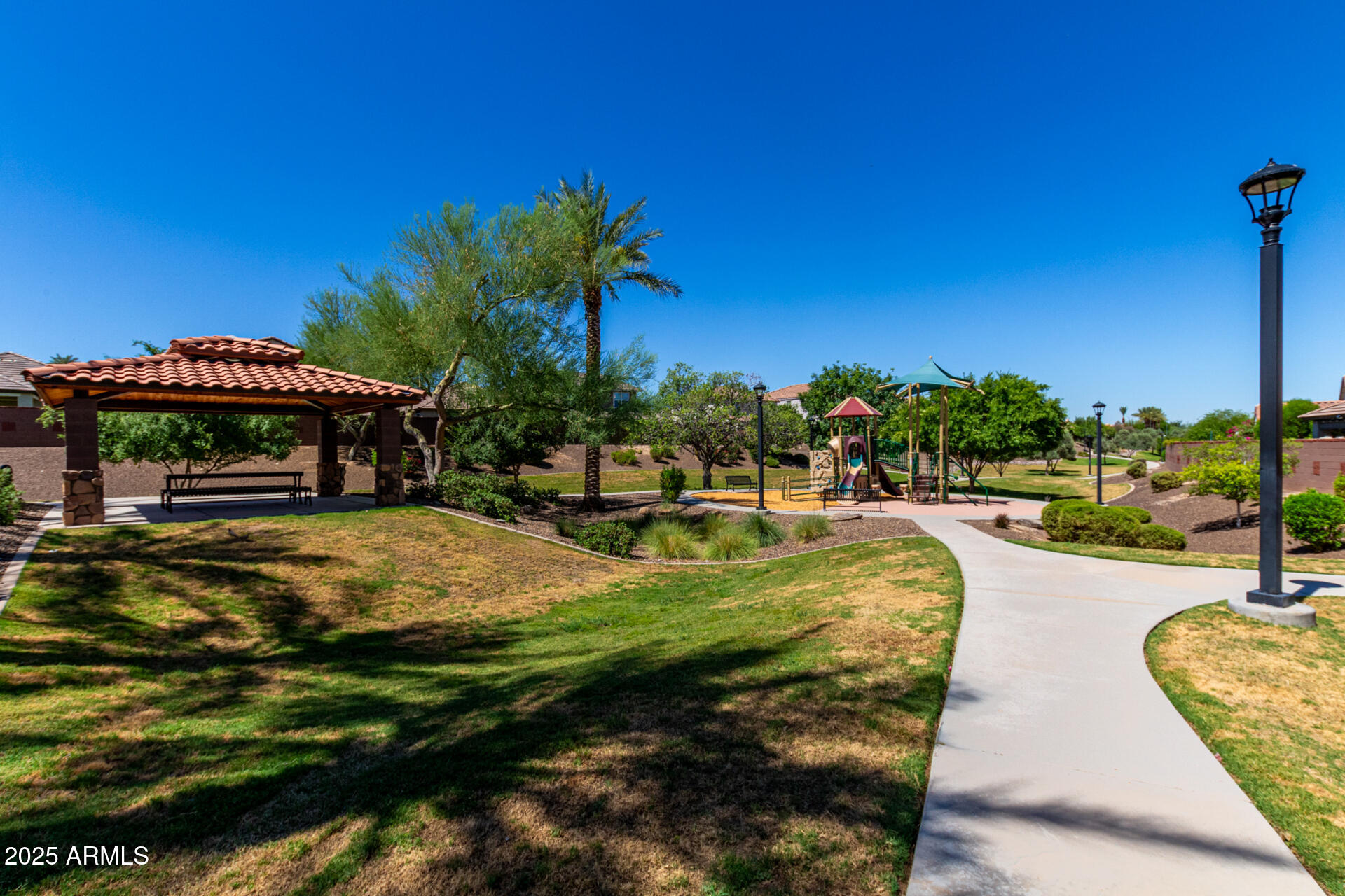 820 Constance Way Phoenix, AZ 85042 - Photo 28 of 29 a swimming pool with outdoor seating and yard