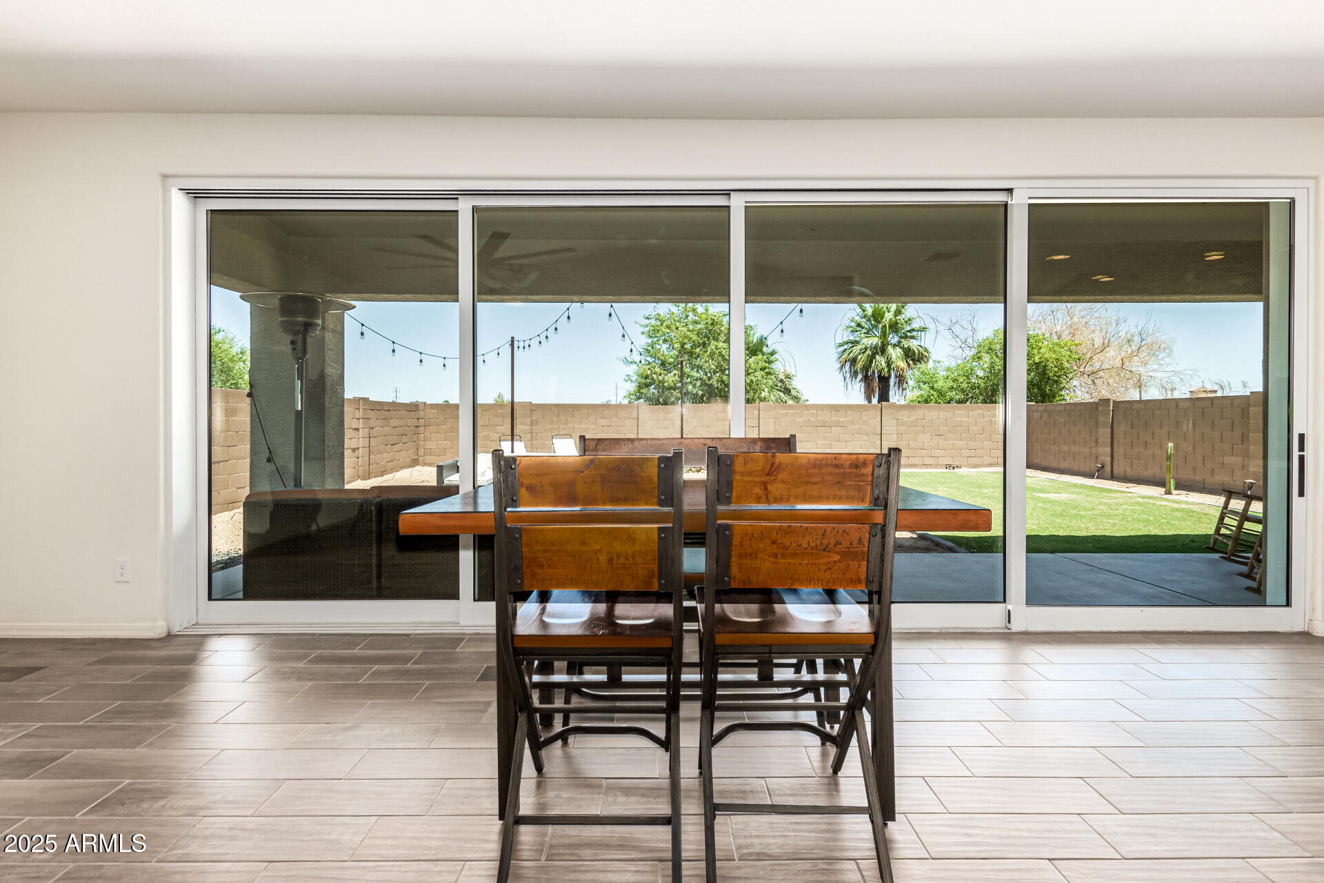 820 Constance Way Phoenix, AZ 85042 - Photo 4 of 29 a outdoor dining space with furniture and window
