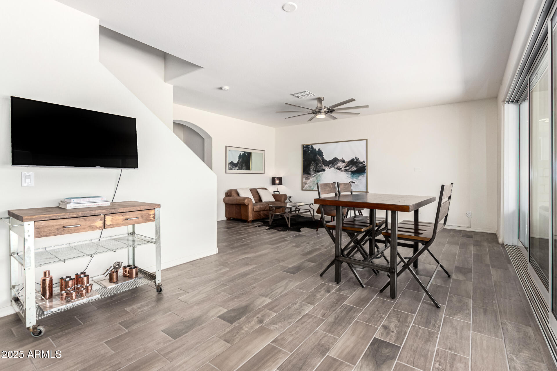 820 Constance Way Phoenix, AZ 85042 - Photo 5 of 29 a living room with furniture and a flat screen tv