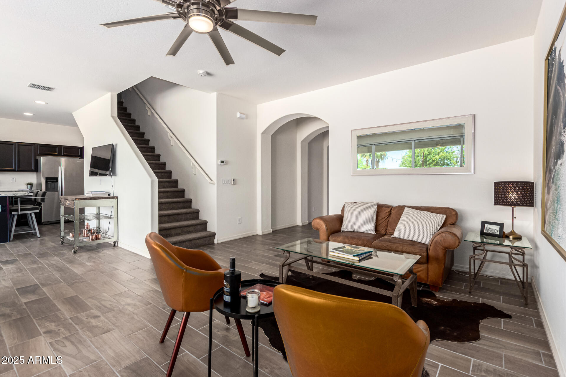 820 Constance Way Phoenix, AZ 85042 - Photo 6 of 29 a work room with furniture and wooden floor