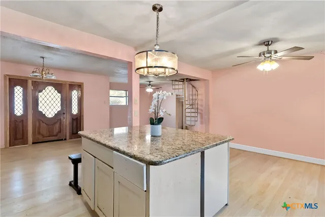 a view of a kitchen counter space a sink and appliances