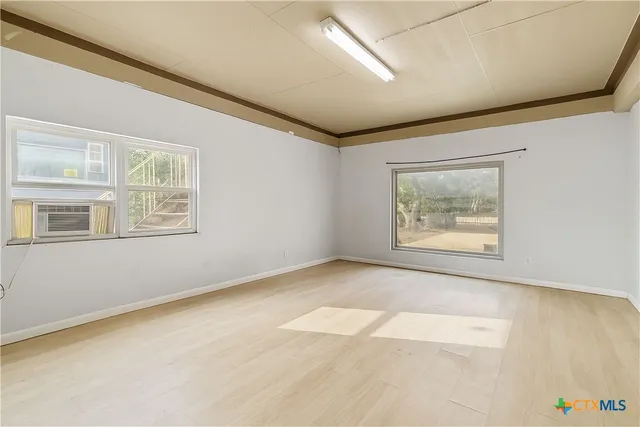 an empty room with windows