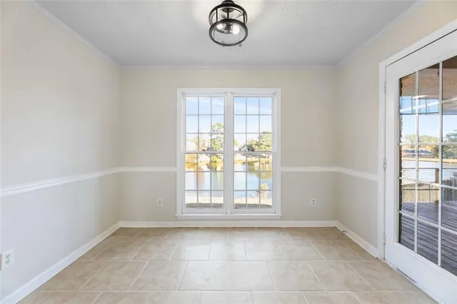 a kitchen with cabinets stainless steel appliances and a counter space