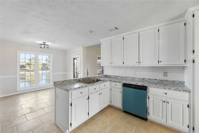 a view of a chandelier and wooden floor in a room