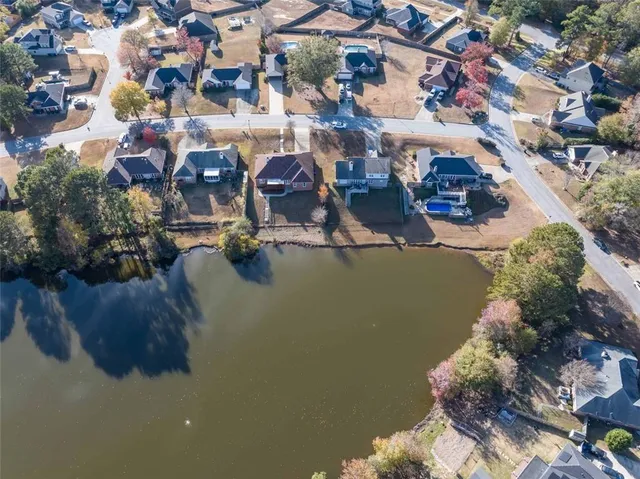 an aerial view of a house with a lake view