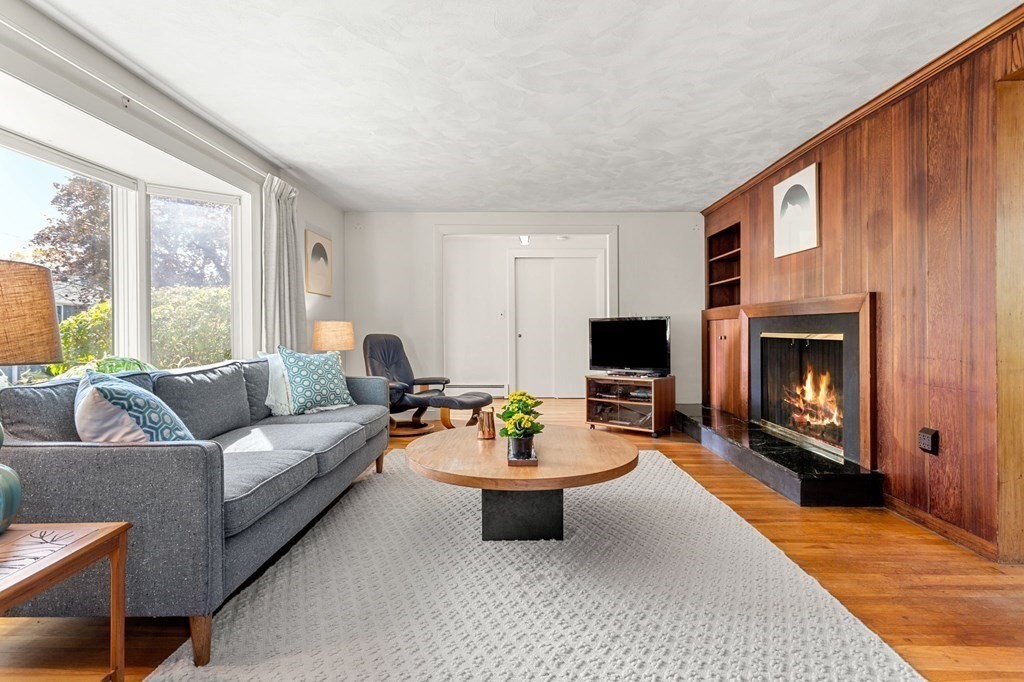 7 Hawthorn Road Marblehead, MA 01945 - Photo 3 of 24 a living room with furniture a window and a fireplace
