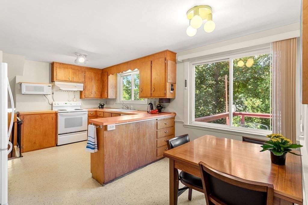 7 Hawthorn Road Marblehead, MA 01945 - Photo 6 of 24 a room with a window dining table and chairs