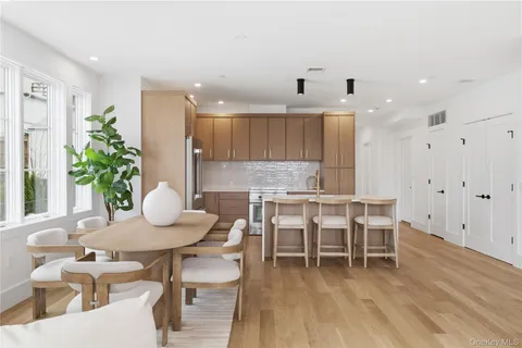 a kitchen with a table and chairs in it