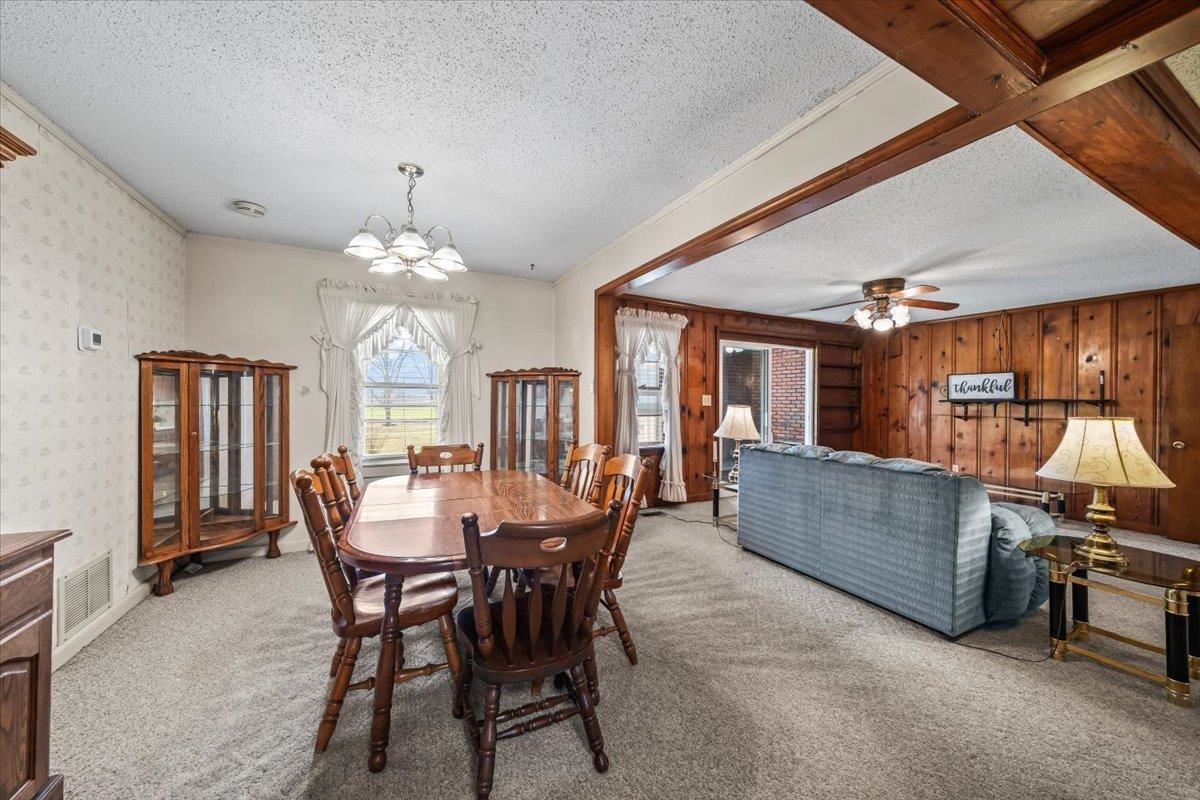 2972 Russell Bond Road Millington, TN 38053 - Photo 11 of 38 Carpeted dining space with a textured ceiling, suspended lighting, and a ceiling fan