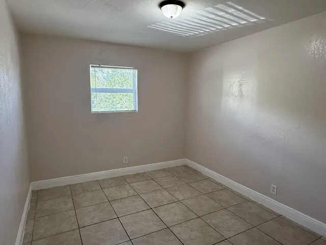 a view of an empty room with a window