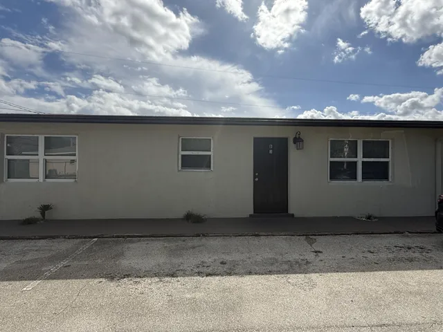 a house view with a backyard space