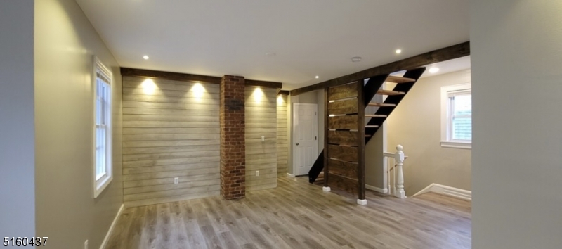 37 Delaware Avenue, Unit 2 Bloomfield, NJ 07003 - Photo 3 of 9 a view of empty room with wooden floor