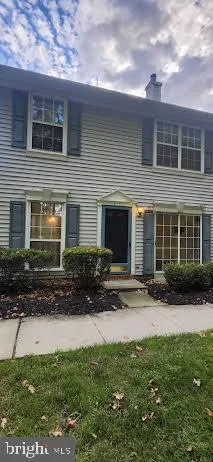 a view of a house with a yard and plants