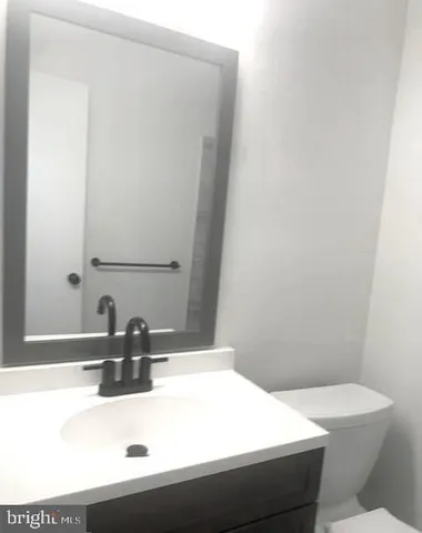 a bathroom with a shower and a toilet