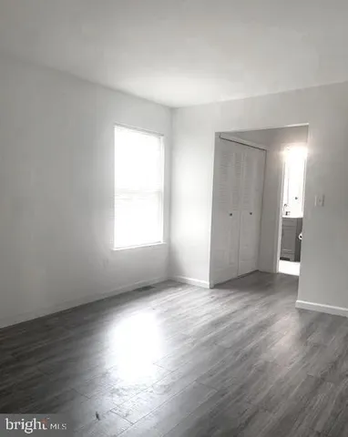 a stove top oven sitting inside of a kitchen