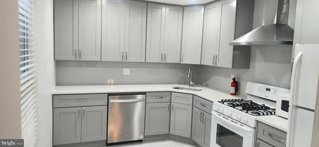 a view of kitchen cabinets and window