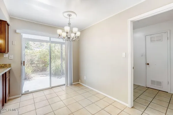 a kitchen with granite countertop cabinets stainless steel appliances a sink and a counter top space