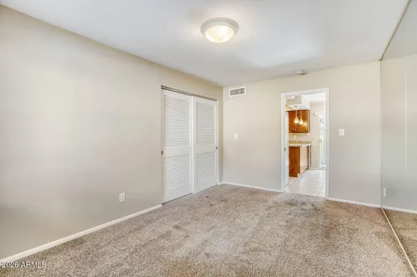 a view of an empty room with windows