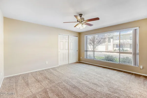 a view of an empty room with a window