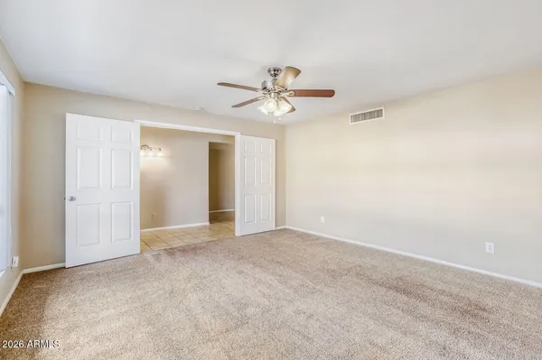 a view of an empty room with a window