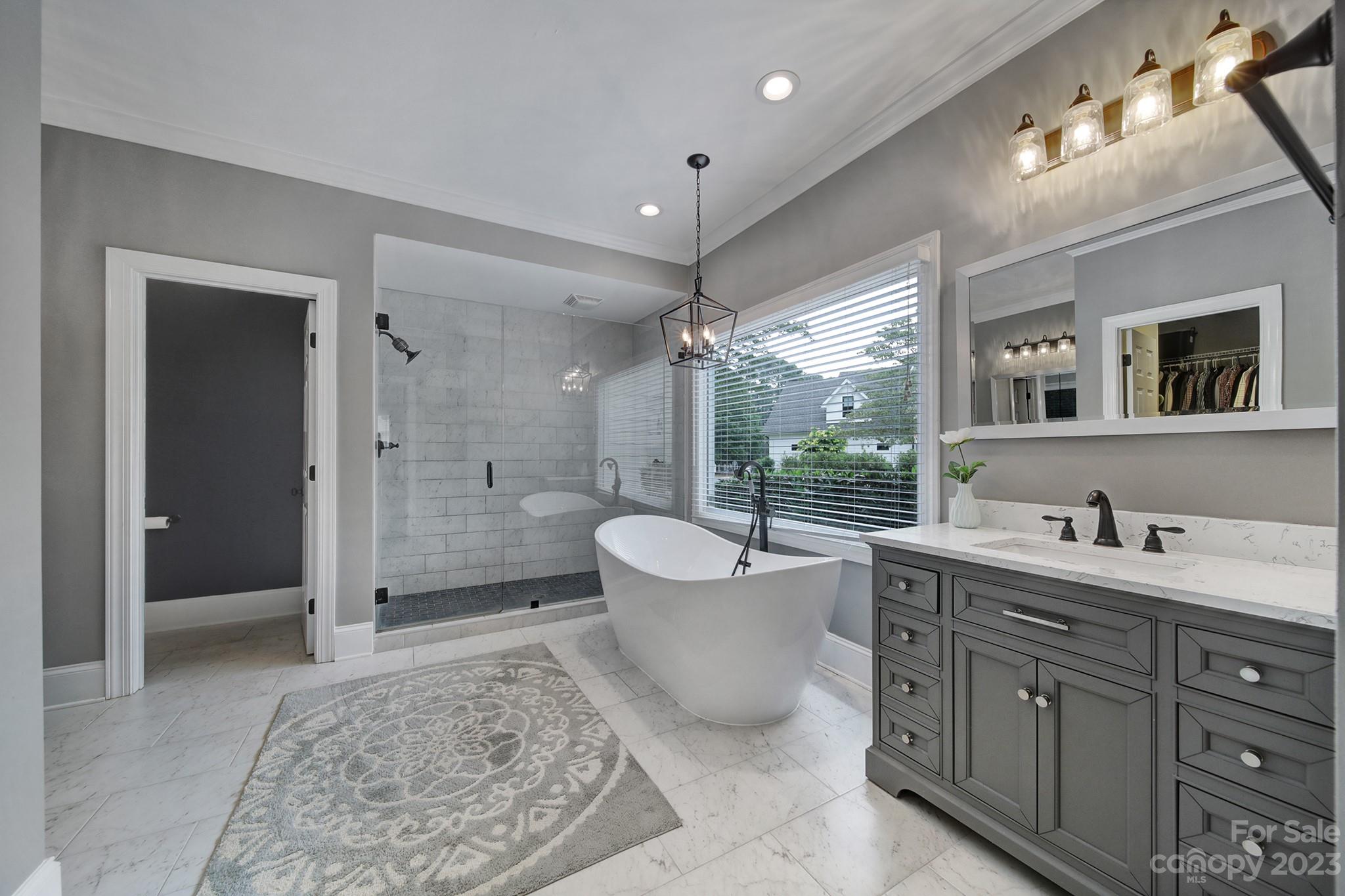 112 Old Post Road Mooresville, NC 28117 - Photo 14 of 42 a spacious bathroom with a double vanity sink toilet mirror and bathtub