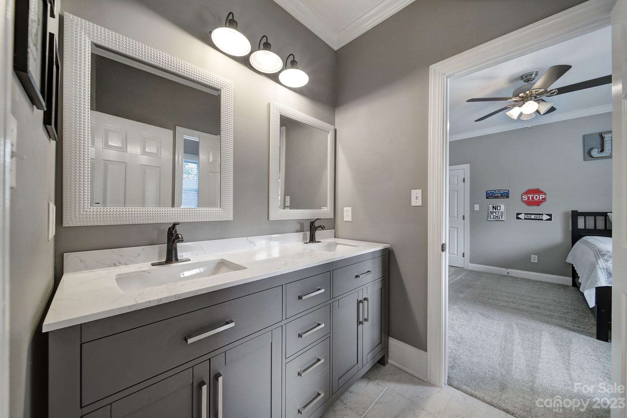 112 Old Post Road Mooresville, NC 28117 - Photo 19 of 42 a bathroom with a double vanity sink and a mirror