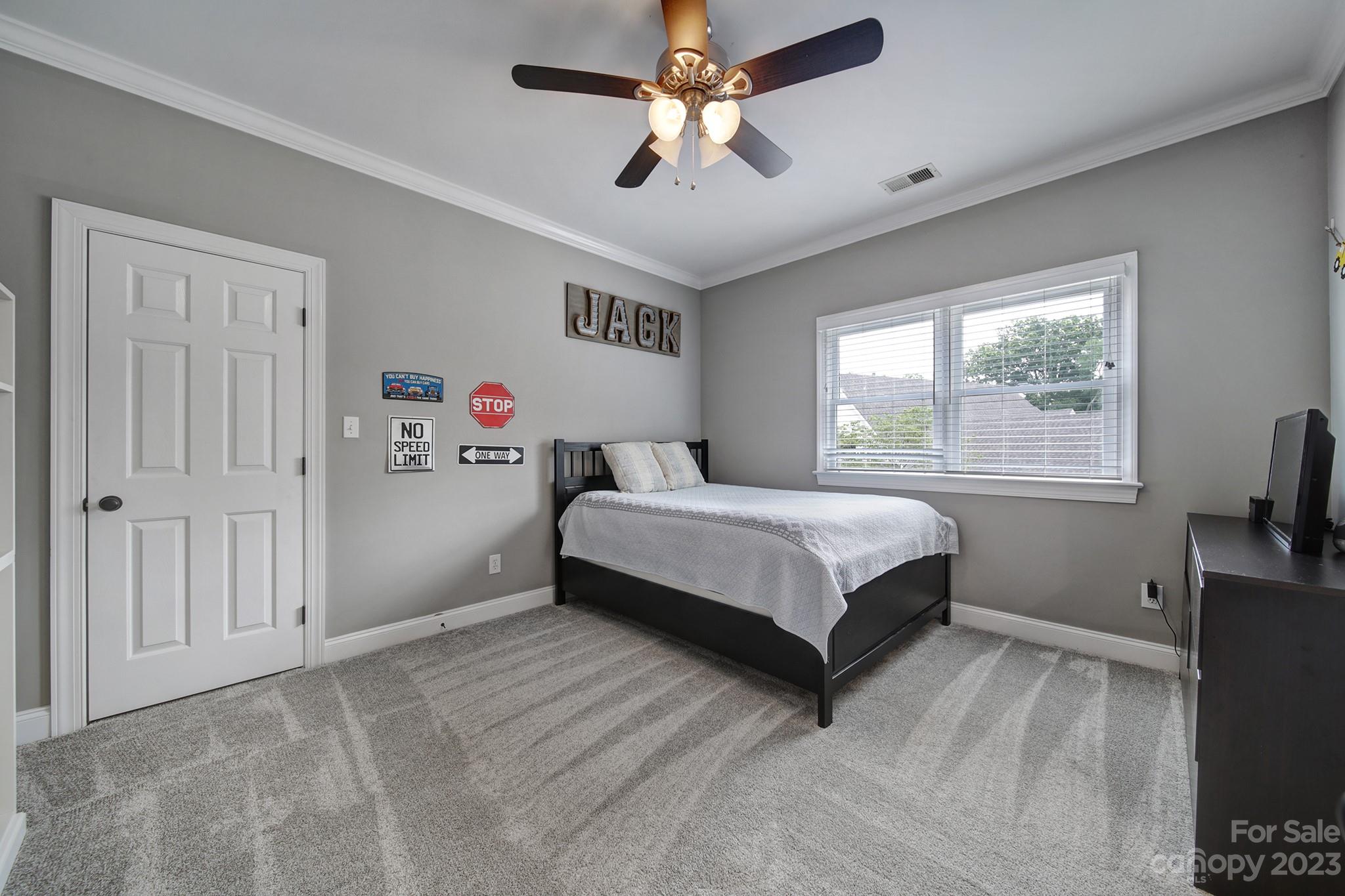 112 Old Post Road Mooresville, NC 28117 - Photo 20 of 42 a bedroom with a bed and a flat screen tv