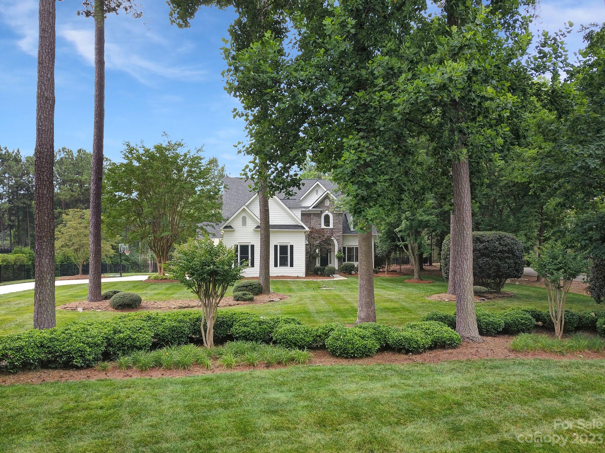 112 Old Post Road Mooresville, NC 28117 - Photo 2 of 42 a front view of a house with a yard and green space