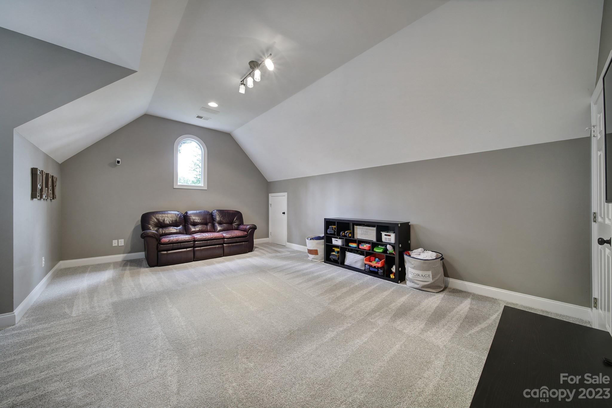 112 Old Post Road Mooresville, NC 28117 - Photo 24 of 42 a living room with furniture and a flat screen tv