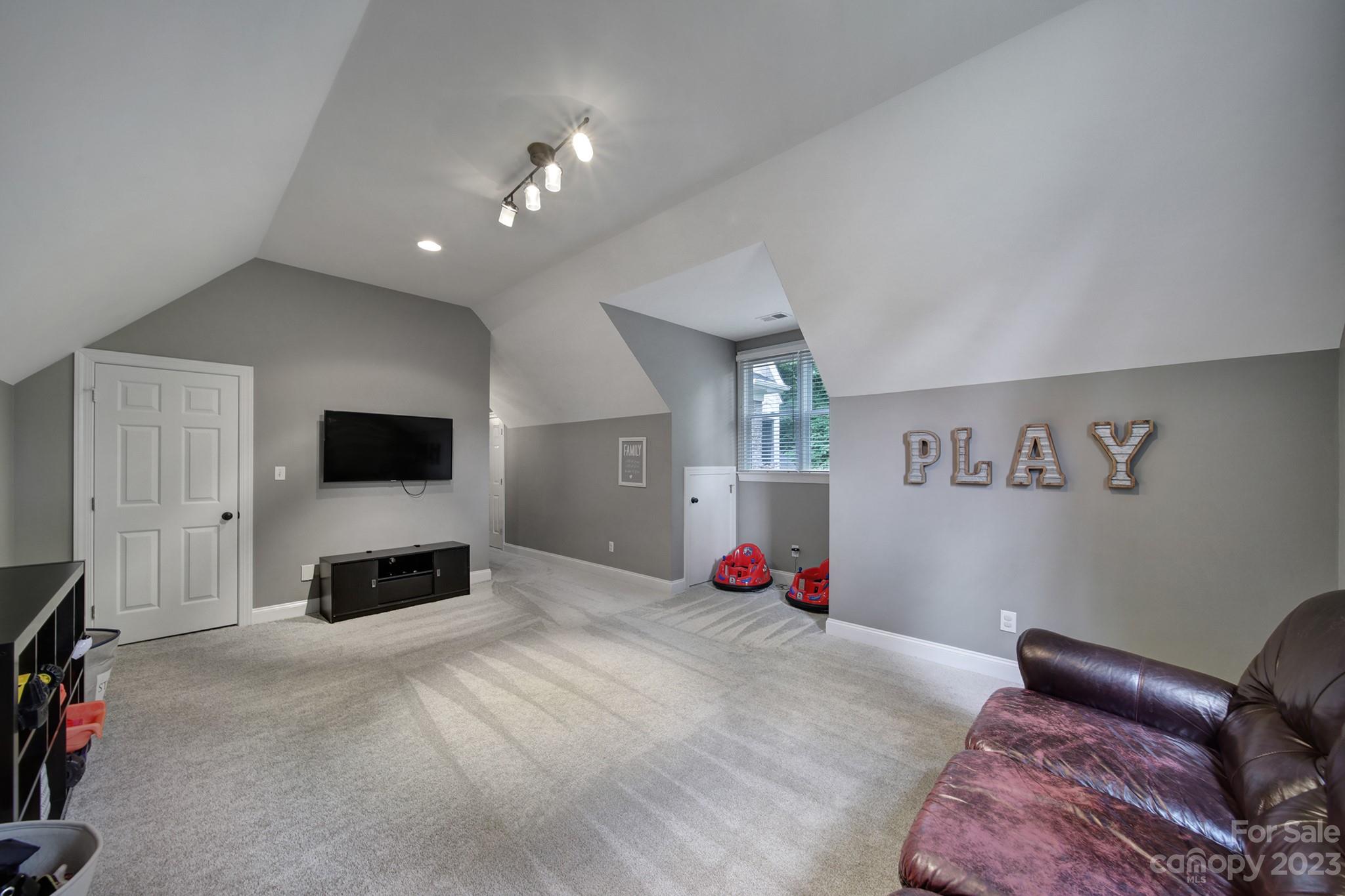 112 Old Post Road Mooresville, NC 28117 - Photo 25 of 42 a bedroom with furniture and a flat screen tv