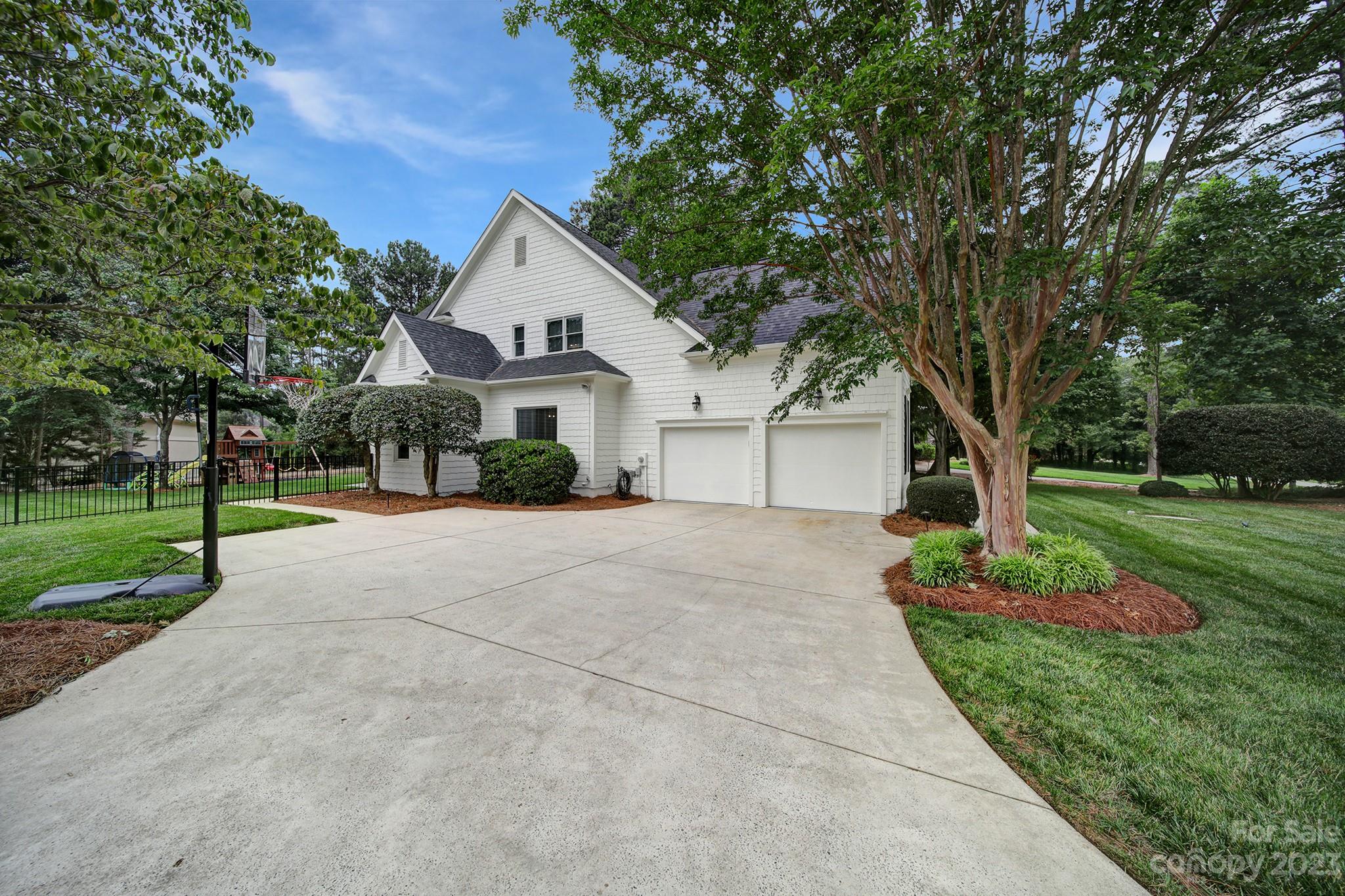112 Old Post Road Mooresville, NC 28117 - Photo 27 of 42 a front view of a house with a yard and trees