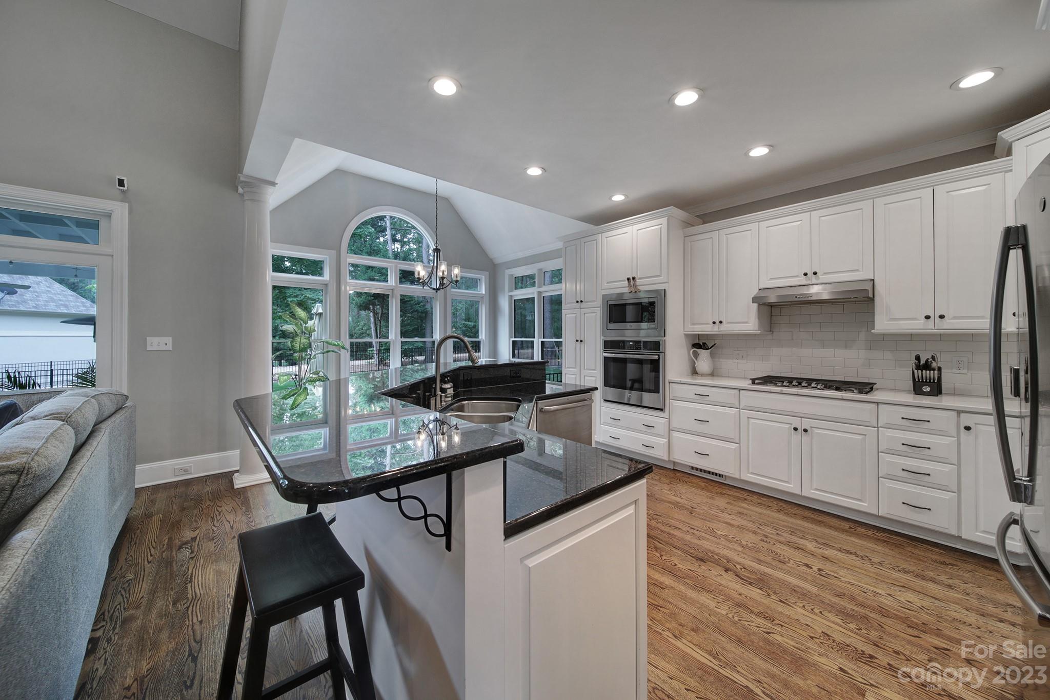 112 Old Post Road Mooresville, NC 28117 - Photo 5 of 42 a kitchen with counter top space cabinets and stainless steel appliances