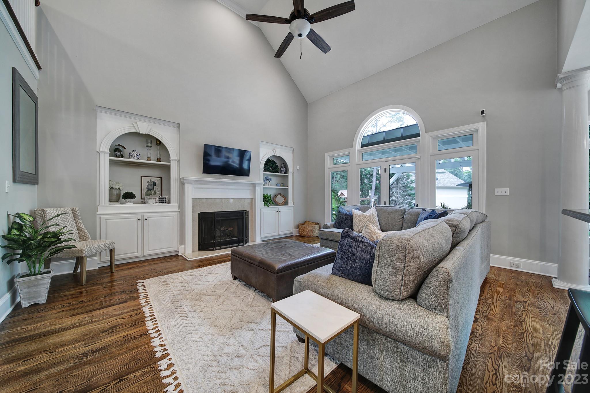 112 Old Post Road Mooresville, NC 28117 - Photo 9 of 42 a living room with furniture fireplace and a large window