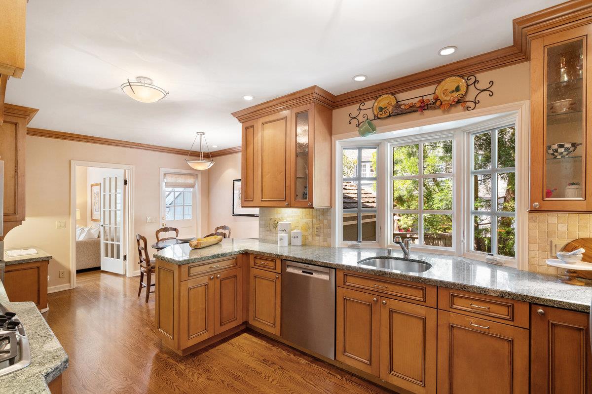 549 Edgewood Road San Mateo, CA 94402 - Photo 15 of 44 a kitchen with lots of counter top space and wooden floor