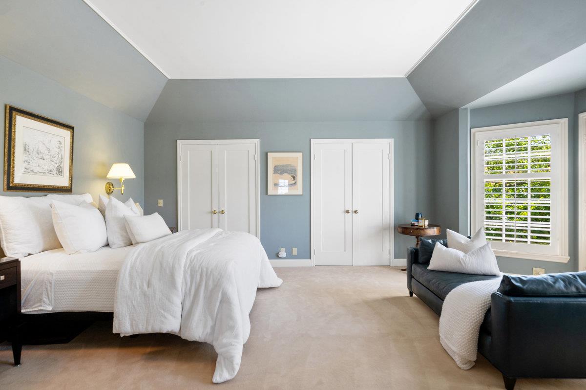 549 Edgewood Road San Mateo, CA 94402 - Photo 20 of 44 a spacious bedroom with a bed and glass window