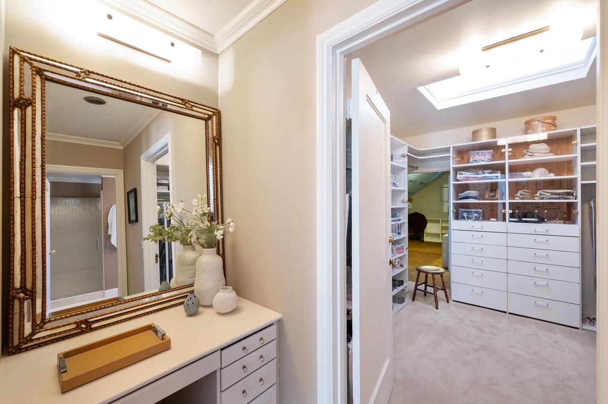 549 Edgewood Road San Mateo, CA 94402 - Photo 26 of 44 a view of walk in closet with clothes and shoes