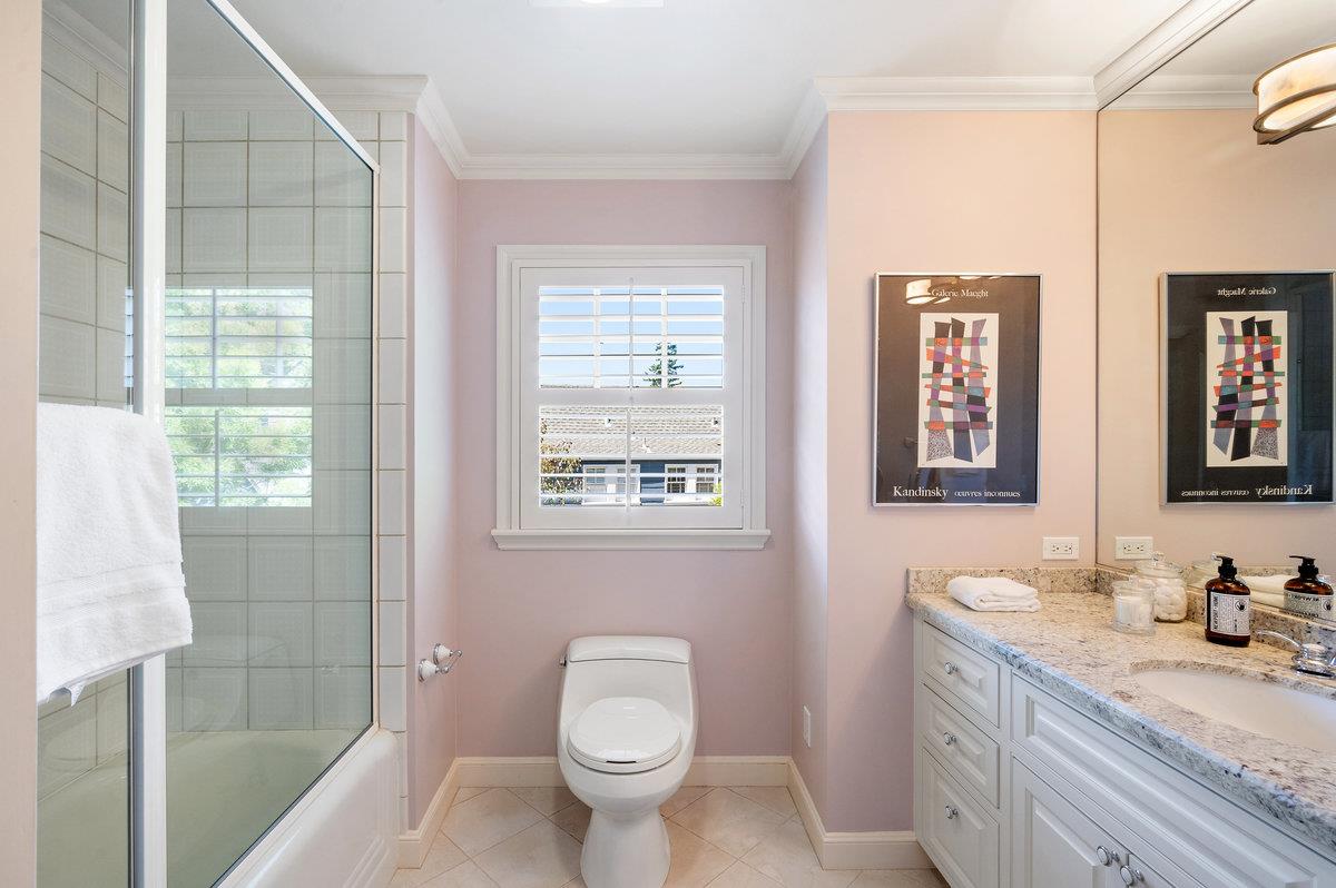 549 Edgewood Road San Mateo, CA 94402 - Photo 30 of 44 a bathroom with a granite countertop sink toilet and shower