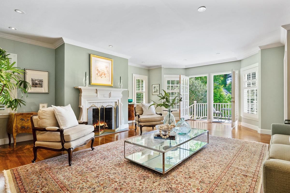 549 Edgewood Road San Mateo, CA 94402 - Photo 9 of 44 a living room with furniture a fireplace and a large window