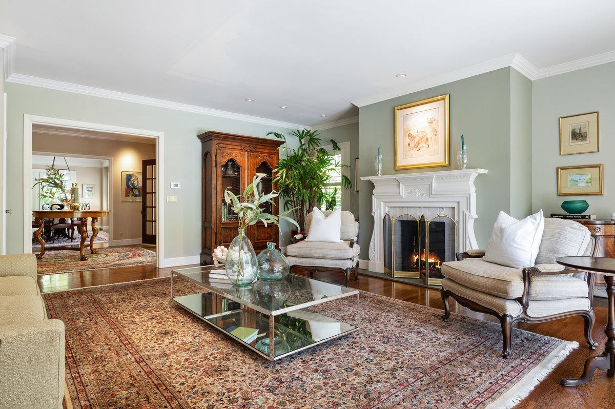 549 Edgewood Road San Mateo, CA 94402 - Photo 10 of 44 a living room with furniture a fireplace and a table