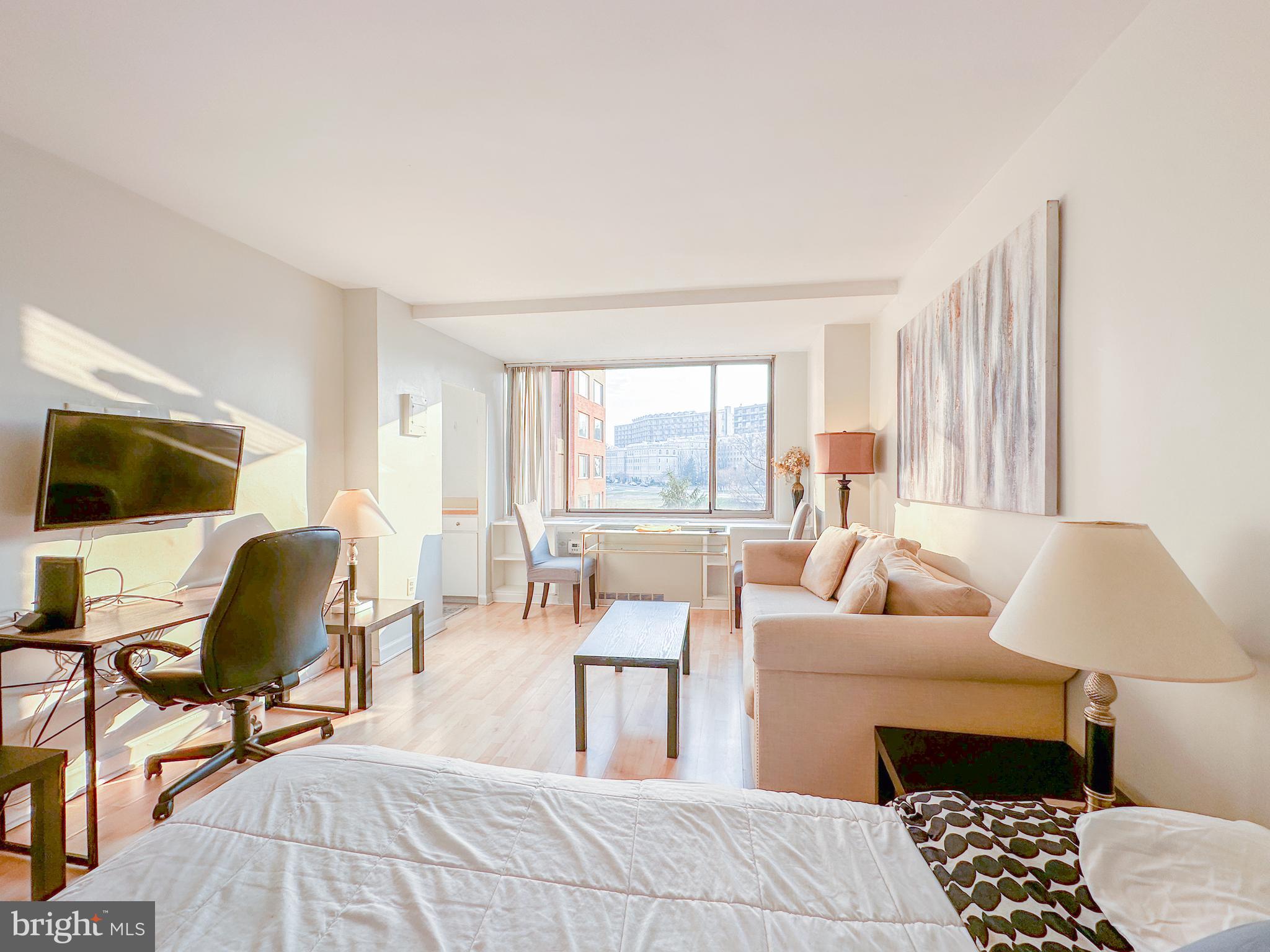 1111 Arlington Boulevard, Unit 615 Arlington, VA 22209 - Photo 1 of 37 a living room with furniture and a window