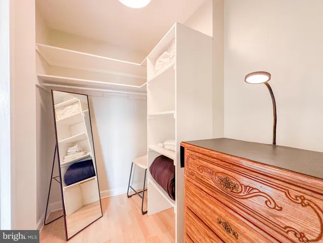 a bedroom with a bed and a chair